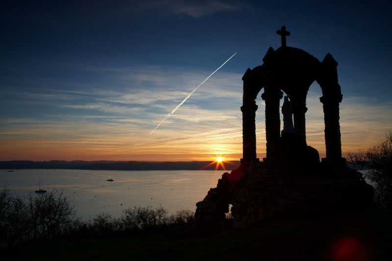 View of Notre Dame Statue over looking the River Rance by the Village of Saint-Suliac at sun set.. Image shot 12/2007. Exact date unknown.